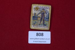 NSDAP Kreisappell Bitterfeld 1935 badge, rectangular embroidered type within gilt frame, showing