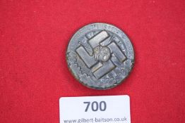 A circular commemorative badge for the NSDAP memorial gathering in Ahaus, 1933. Large swastika