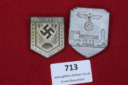Two pressed-metal day badges: the first commemorating the Walkemühle gathering, dated 1st July 1934;