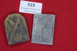 Two early tinnies, comprising a Kraft durch Freude (KdF) badge with skis and swastika, and a 1939