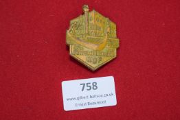 German KdF (Kraft durch Freude) travel badge, gilt pressed alloy, Mittelmeerreisen 1938–1939,