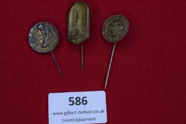 Three pre-Third Reich commemorative stickpins, including: a WWI Kriegsgefangenen (Prisoner of War)