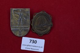 Two German Third Reich Day Badges: one shield-shaped bronze example for the NSDAP Gautag der Gau