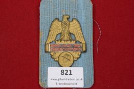 German Reservist Badge, gilt eagle with red enamel scroll “Hoch lebe der Reservemann”, helmeted bust