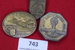 Three German Third Reich Day Badges: a gilt shield-shaped badge for Tag der Arbeit, Fürth 1. Mai