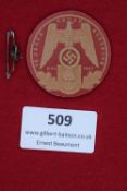 A German NSDAP 15 Jahre Augsburg 1937 day badge, circular in red pressed card with eagle and