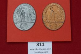 Two Kreis-Schießen Kufstein badges, 1944, oval form in zinc and bronze finishes, each with eagle