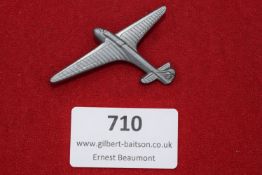 Die-cast aluminium badge in the form of a glider aircraft, with fine ribbed wing detail and swastika