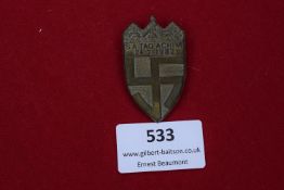 A Third Reich SA Day badge, Achim, dated 24th July 1932. Shield-shaped design featuring a cross