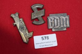 A group of three Hitler Youth and BDM day/tinnie badges. Comprising HJ Bann Treffen in the form of a