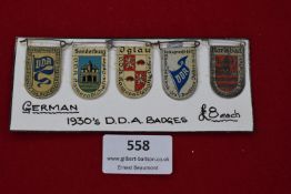 Five German 1930s VDA (Volksbund für das Deutschtum im Ausland) badges, each with city crests