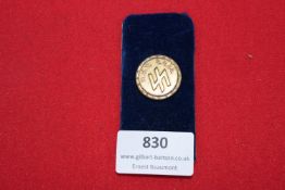 A small circular enamelled NSDAP Badge with 