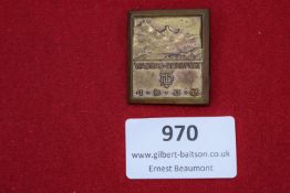 Bronzed rectangular badge for the Wasgau Mountain Festival, dated 1.9.1933. The design depicts a