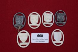 Six WHW plastic city crest badges in mixed colours, including Graz (grey), Luxemburg, Innsbruck,