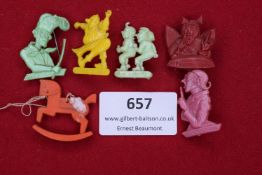 A group of 6 WHW plastic donation badges, including figures from Wilhelm Busch’s 