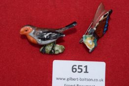A finely modelled porcelain bird and butterfly, both hand-painted and fitted with rear pin