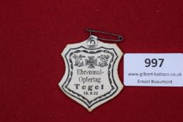 Ehrenmal Opfertag Tegel, 10.9.33, a paper day badge in shield form, black printed design with Iron
