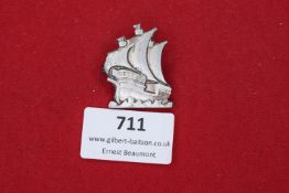 A Third Reich period day badge in the form of a galleon under full sail, marked on reverse 