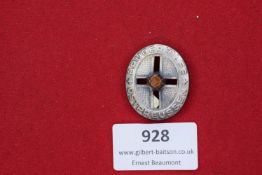 Brüderhilfe Cross Badge – Small oval badge with cut-out cross and inscription Bruderhilfe Preussen