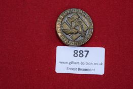 NSBO Badge, Köln-Aachen 1933. Circular bronze badge featuring the cogwheel and sword emblem of the