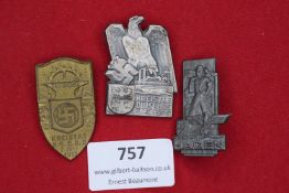 Three German NSDAP Kreistag badges, comprising: bronze shield-shaped badge Kreistag N.S.D.A.P. Bad