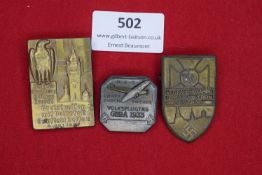 Three event badges: a rectangular bronze example for Kreistreffen mit Volksfest, Gau Dessau, 1937,