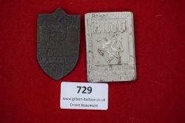 Two German Third Reich Day Badges: one shield-shaped example for 700 Jahre Calau (1936), castle