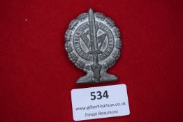 A Third Reich SA Brigade rally badge, Göttingen 1935. Oval zinc example with oakleaf wreath, central