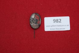 German Stickpin Badge, oval, enamel with cogwheel and flag motif, inscribed Mai Feier 1928, long pin