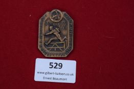 A SA Sportfest badge, Standarte 143 Recklinghausen, bronze example depicting a figure in athletic