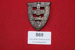 Reichsarbeitsdienst “Grebenstein” Tinnie – Pressed metal badge with RAD spade and swastika emblem