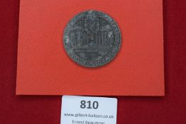 German Veterans’ badge, 1916, circular grey metal example depicting temple-like structure, inscribed