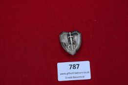 German shield-shaped badge, sword over hydra design, silvered finish