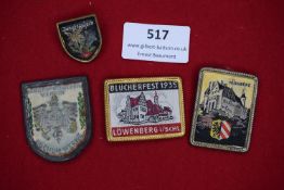 A mixed lot of four commemorative badges, including Jungfraujoch floral motif, Blücherfest 1935