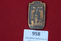 A bronze-toned commemorative tinnie issued for the 600th anniversary celebrations of Tachau, dated