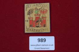Angermünde Heimatfest Badge, 1933, a wooden painted badge marked “Heimatfest Angermünde 1933” with