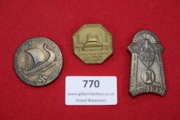 Three German commemorative badges, including 1937 Oldenburg Gautag Viking ship, 1932 Geldern