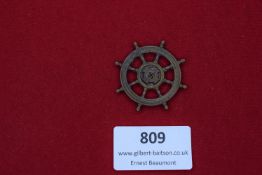 Kriegsmarine style badge, bronze in the form of a ship’s wheel with central swastika