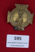 A 1932 N.S. Treffen badge, issued for the rally held in Dessau, featuring a figure of a marching
