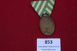 Bronze medal with ribbon, inscribed “Für Treue in der Arbeit” (For Loyalty in Work), reverse