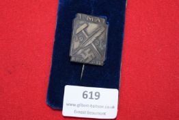 A scarce rectangular German Labour Day badge dated 1. Mai 1935, featuring hammer, quill and swastika