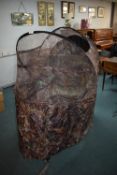 A portable pop-up camouflage shooting hide, design