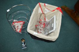 Basket Containing Pan Stands, Bunting, and Photo Frames