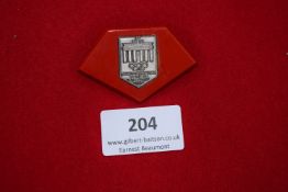 Olympic Games Berlin 1936 Badge, diamond-shaped red plastic and metal badge depicting Brandenburg