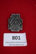 Leipzig Fair Badge, a pressed-metal rectangular badge with stepped architectural design and