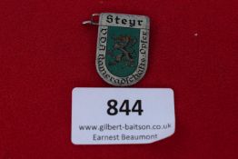 Steyr Badge, a small pressed-tin shield badge with enamelled-style depiction of heraldic lion and