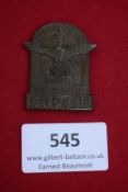 Braune Messe Lübeck 1933 Badge, a rectangular bronze-finish badge surmounted by eagle and swastika