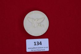 Hitler Youth Regional Rally Badge, 1939, a white plastic round badge embossed with eagle and spade