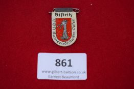 Bistrith VDA Donation Badge, pressed-tin badge depicting a heraldic eagle’s head and neck on red