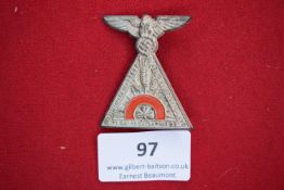 Triangular tinnie badge, dated 27 May 1934, SA event at Steyr. Features eagle and swastika above,